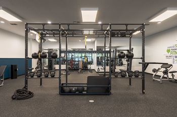 a view of the weights area in the gymat The Harbours Apartments, Clinton Twp